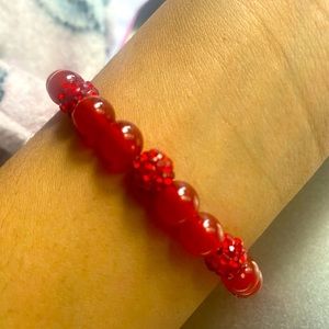 Red bracelet. Great quality. Stretchy. For women. One size fits all.